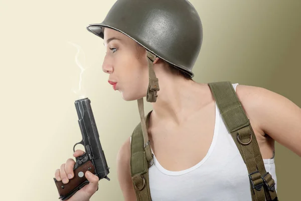 Pretty young woman dressed in ww2 american military uniform with — Stock Photo, Image