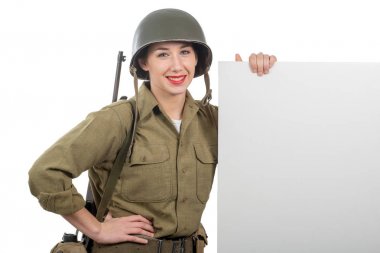 young woman dressed in American ww2 military uniform showing emp