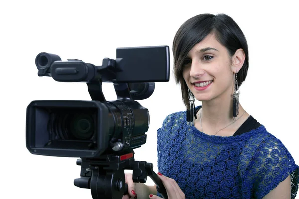 Mujer joven con cámara de vídeo profesional, en blanco — Foto de Stock