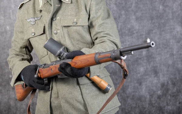 WW II German soldier with rifle and grenade — Stock Photo, Image