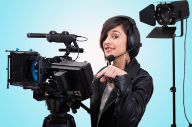 young woman with professional video camera, DSLR