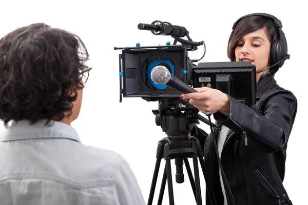 Pretty young woman  journalist with microphone with video camera — Stock Photo, Image