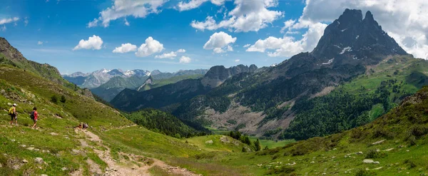 two hiker women in path of Pic du Midi Ossau in the french Pyrenees mountains