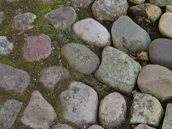 wild stones on the floor.pavement of stones.