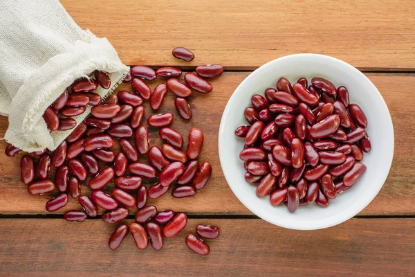 Vista Superior Frijoles Rojos Saco Tazón Mesa Madera Concepto Comida Fotos de stock libres de derechos