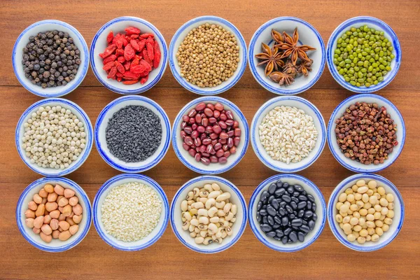 Various kinds of beans and grains,different kinds of beans and grians in bowl on wooden table.Healthy and nutrition food concept.Different dry beans and grains for eating healthy, diet and healthy lifestyle.