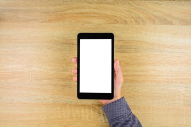 Online çalışma evde ahşap masa üzerinde office beyaz bir ekran ile dijital tablet holding iş adamı. Metin için yer kopyalayın.