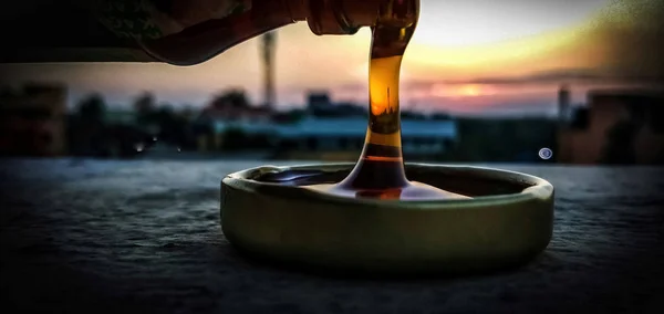 Tasty honey in a cup in early morning — Stock Photo, Image