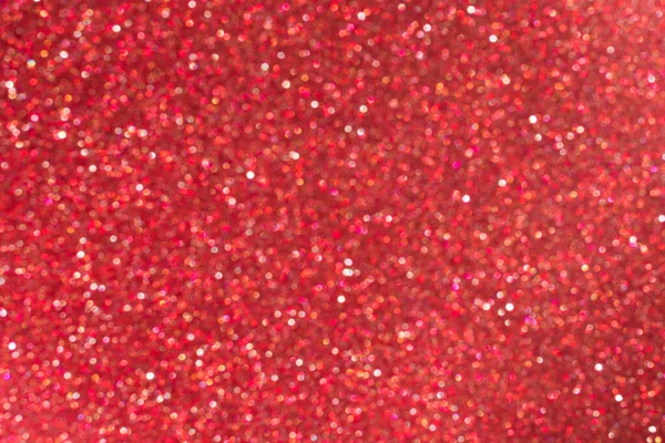 Bright blurred abstract red background with shimmering glitter and sparkles. — Stock Photo, Image
