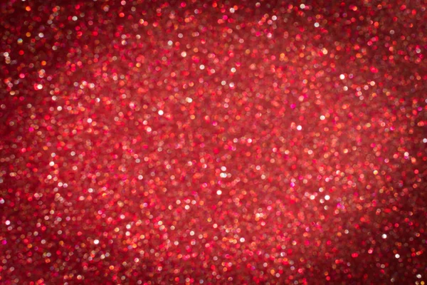 Bright blurred abstract red background with shimmer glitter and sparkles with dark vignette — Stock Photo, Image