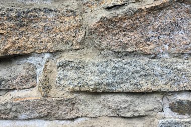 Arka plan veya doku için eski bir taş duvarın bir parçası.