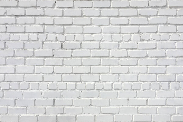 Brick wall painted white. Background and texture. Can be used in the interior.
