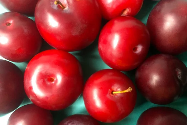 Ripe Juicy Plums Plain Blue Background Close Top View — Stock Photo, Image