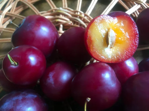 Ripe Juicy Plums Wooden Structure Woven Young Branches Half Cut — Stock Photo, Image