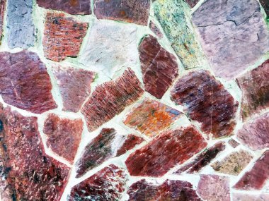 Arka plan veya doku için eski bir taş duvarın bir parçası.