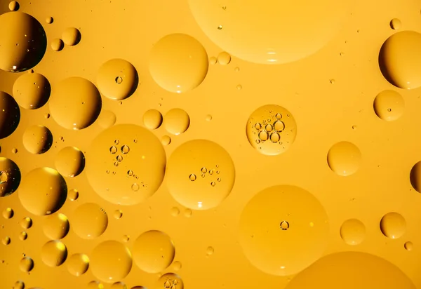 golden yellow bubble oil droplet, abstract background