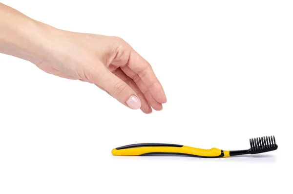 Escova Dentes Macia Preta Amarela Com Mão Isolada Fundo Branco — Fotografia de Stock