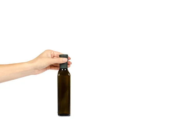 Groene Fles Olijfolie Met Hand Geïsoleerd Een Witte Achtergrond Ruimte — Stockfoto