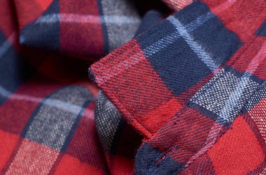 Makro fotoğraf kumaş desen, tekstil giyim alan sığ derinliği ile kapatın. Yumuşak malzeme arka plan bulanık