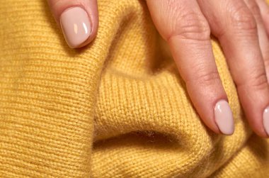 Makro fotoğraf kumaş desen, tekstil giyim alan sığ derinliği ile kapatın. Yumuşak malzeme arka plan bulanık