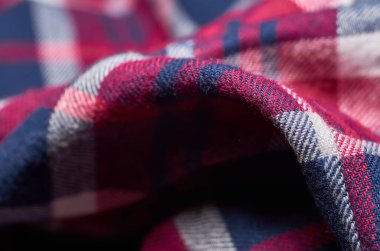 Makro fotoğraf kumaş desen, tekstil giyim alan sığ derinliği ile kapatın. Yumuşak malzeme arka plan bulanık