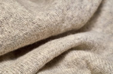 Makro fotoğraf kumaş desen, tekstil giyim alan sığ derinliği ile kapatın. Yumuşak malzeme arka plan bulanık