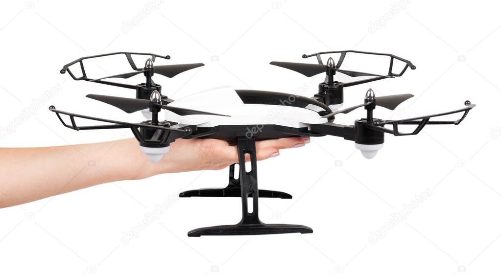 Hand with remote control drone, fun toy for kids, air sport game. Isolated on white background