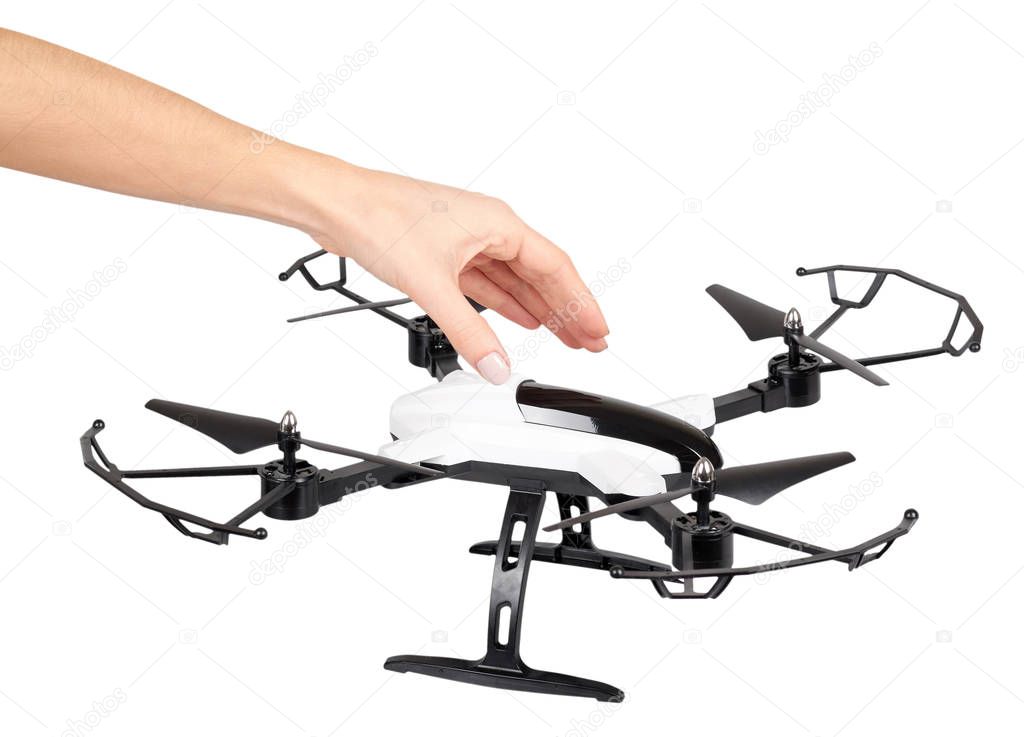 Hand with remote control drone, fun toy for kids, air sport game. Isolated on white background