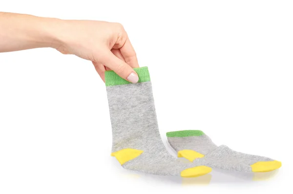 Ruka s teplou Zimní dětské ponožky, roztomilé bavlněné oblečení — Stock fotografie