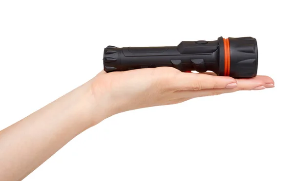 Hand with black LED flashlight, compact lighting for travel. — Stock Photo, Image