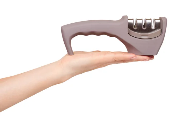 Hand with gray knife sharpener with handle, kitchen utensil. — Stock Photo, Image