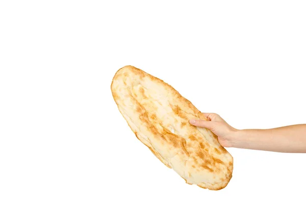 Hand mit goldenem Pitta-Brot, östliche Esskultur — Stockfoto