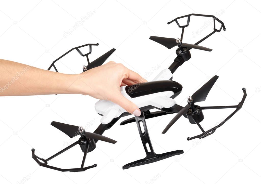 Hand with remote control drone, fun toy for kids, air sport game.