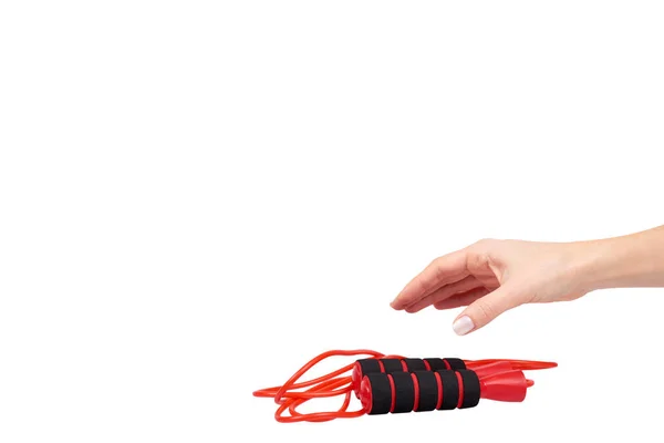 Corda de salto vermelho com mão para fitness e vida esportiva . — Fotografia de Stock