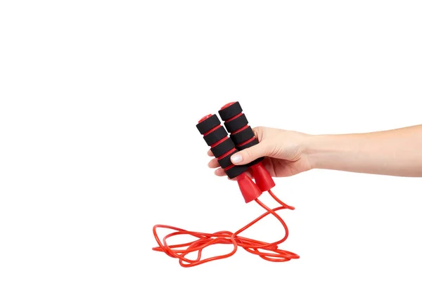 Corda de salto vermelho com mão para fitness e vida esportiva . — Fotografia de Stock