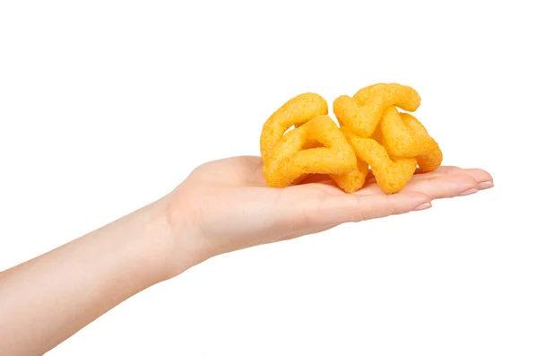 Hand with cheese puff sticks, crunchy corn snack, unhealthy food. — Stock Photo, Image