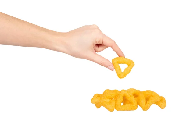 Hand with cheese puff sticks, crunchy corn snack, unhealthy food. — Stock Photo, Image