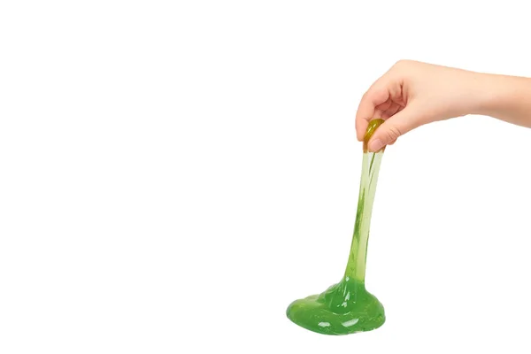 Niño jugando limo verde con la mano, juguete transparente — Foto de Stock