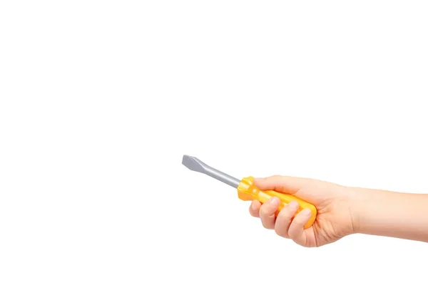 Crianças mão com chave de fenda de brinquedo amarelo, ferramenta de reparo — Fotografia de Stock