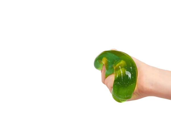 Kid groene slime met hand, transparante speelgoed spelen — Stockfoto