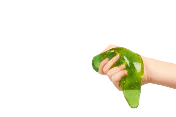 Kid groene slime met hand, transparante speelgoed spelen — Stockfoto