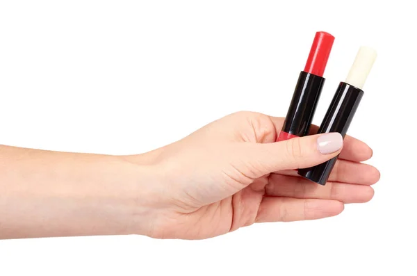 Hand med rött och vitt balsam läppstift, läppar vård och skönhet — Stockfoto