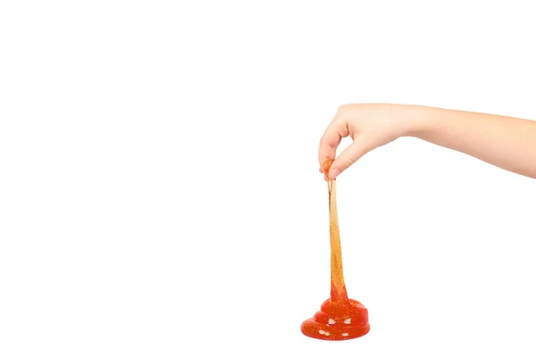 El, şeffaf oyuncak ile turuncu sümük oynayan çocuk — Stok fotoğraf