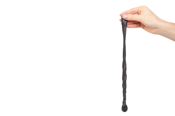 십 대 손으로, 투명 한 장난감 검은 점액을 재생 — 스톡 사진