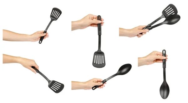 Mano con utensilios de cocina de plástico negro, set y colección . —  Fotos de Stock