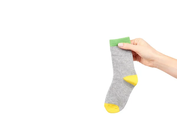 Hand mit warmen Winter-Kindersocken, niedlicher Baumwollkleidung — Stockfoto