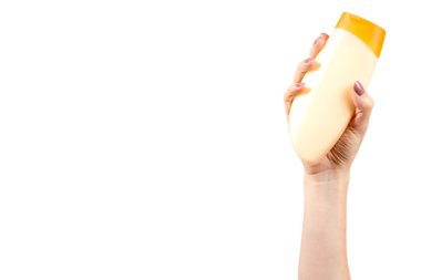 Plastik kozmetik şişe, şampuan ve sabun jeli ile el.