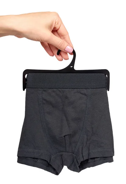 Hand with dark boxer underwear, cotton pants. — Stock Photo, Image