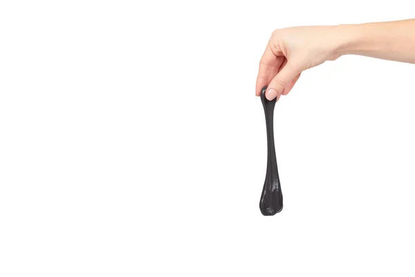 Dospívající hrát černý sliz s rukou, transparentní hračka — Stock fotografie