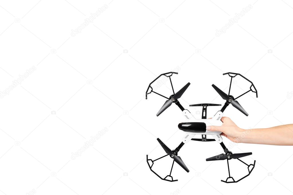 Hand with remote control drone, fun toy for kids, air sport game.